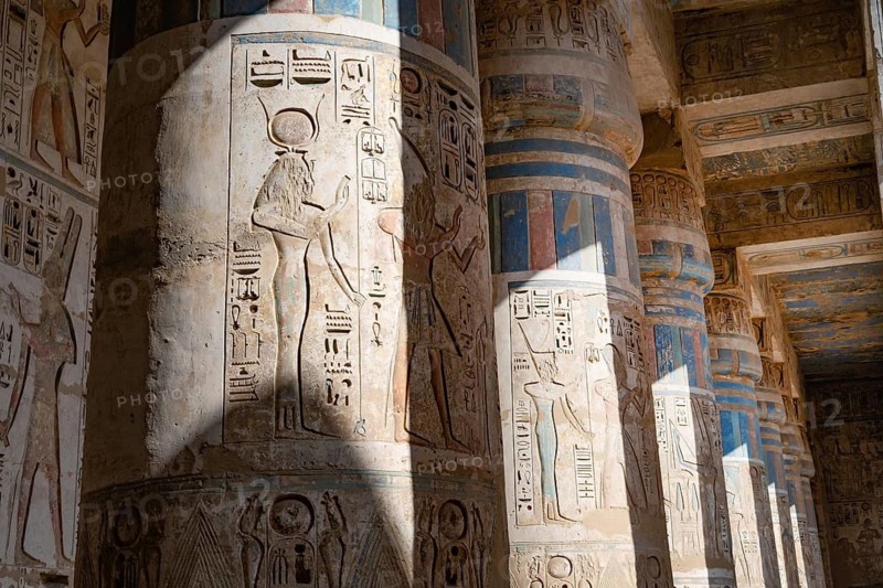 Close up details of the reliefs and hieroglyphs inside Medinat Habu, the ancient Egyptian Mortuary Temple of Ramesses III on the West Bank of The Nile, Luxor, Egypt