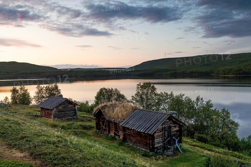 Wooden houses, old church houses, farm buildings on Mantojärvi, Utsjoki or Ohcejohka, Lapland, Finland