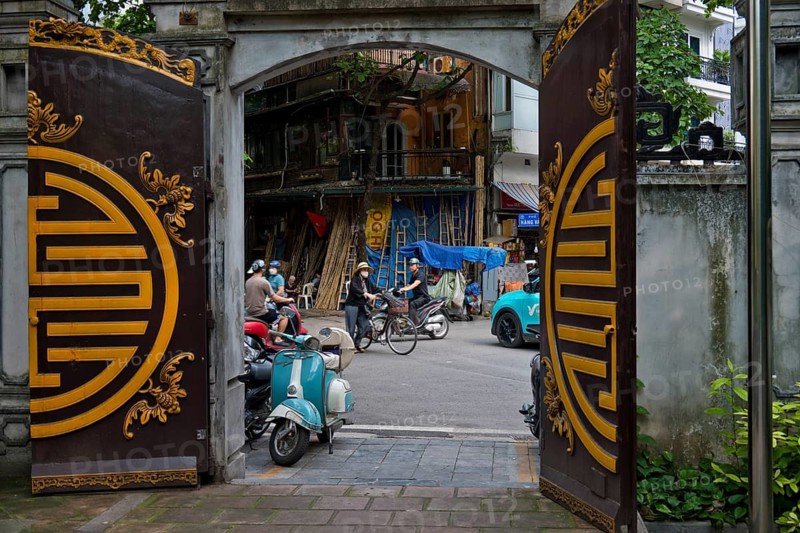 A view from a historic temple courtyard of handcrafted bamboo ladders, metre-long bamboo poles, bamboo tubes and traditional water pipes on Hàng V?i Street (Bamboo Street), in the Old Quarter of Hanoi, Vietnam