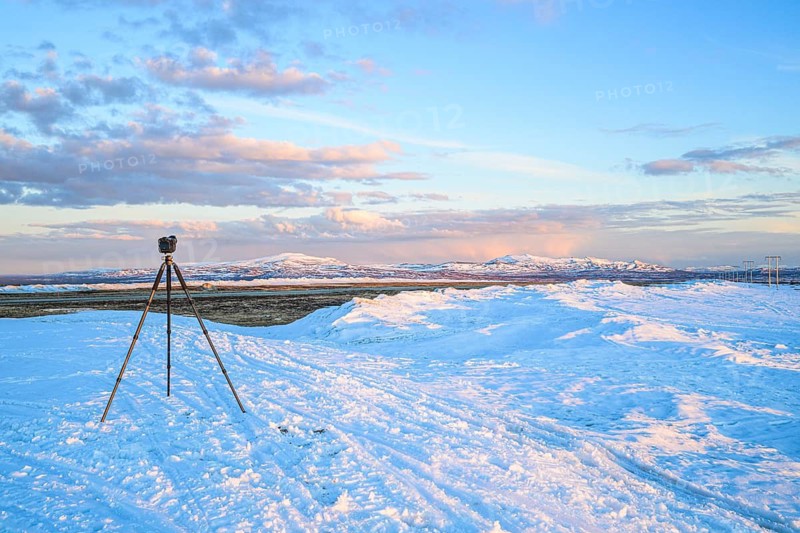 Flatruet, Berg, Härjedalen Län, Sweden, camera on tripod in snowy landscape with mountain panorama and clouds