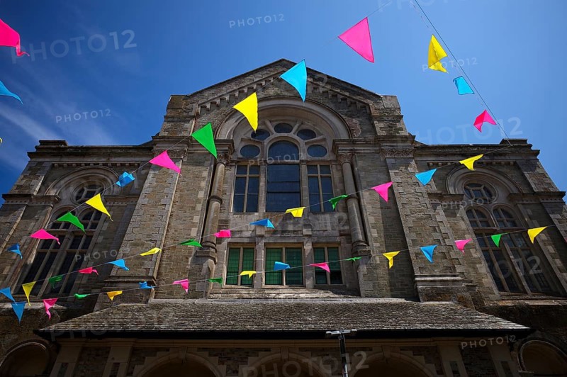 Colourful pennants, flags, sky, blue, behind former church, Falmouth, Cornwall, England, Great Britain, Great Britain