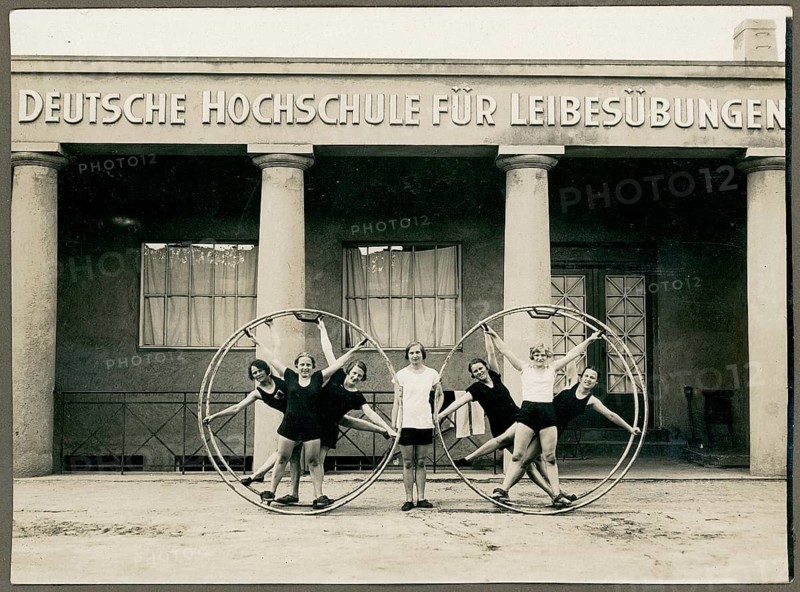 German University of Physical Exercises, Berlin, sports, gymnastics, gymwheel, education, woman posing in front of a building, Gerhard Riebicke, around 1930