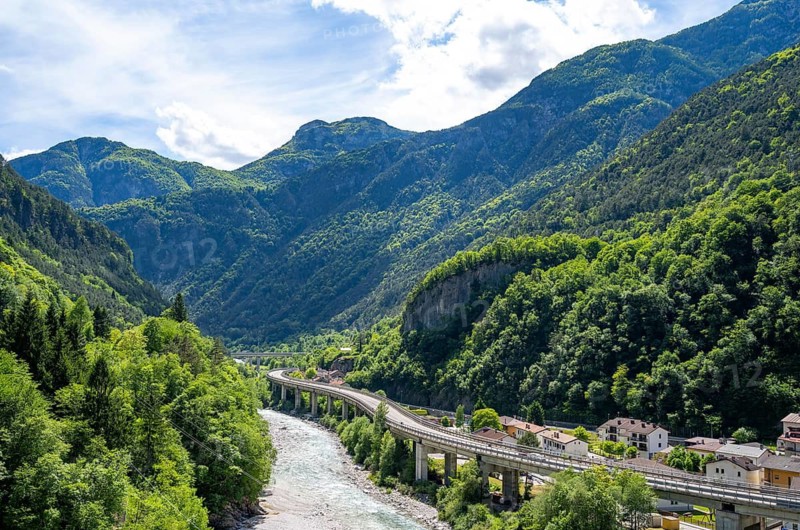 Mountain landscape and river La Fella in Eisental with highway, Dogna, Julian Alps, Friuli-Venezia Giulia, Italy