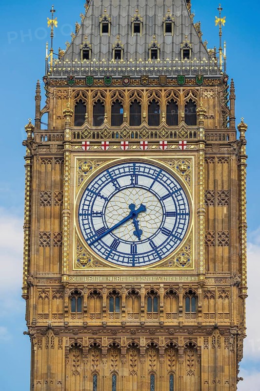 Gilded Roman numerals and tracery detail the Elizabeth Tower clock face, home to Big Ben, at the Houses of Parliament, London, England, United Kingdom