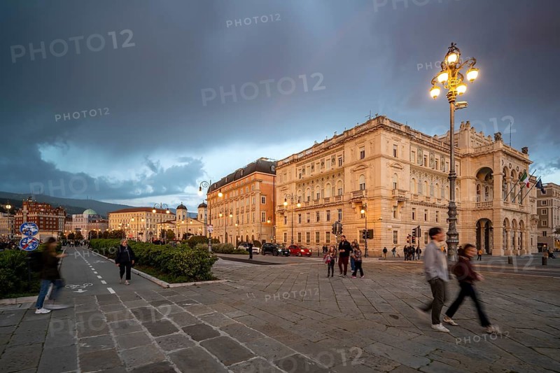 Magnificent buildings and palazzos on the seafront Riva del Mandracchio, Palazzo della Luogotenenza Austriaca or Palazzo Governo, dramatic clouds at sunset, Trieste, Friuli-Venezia Giulia region, Italy