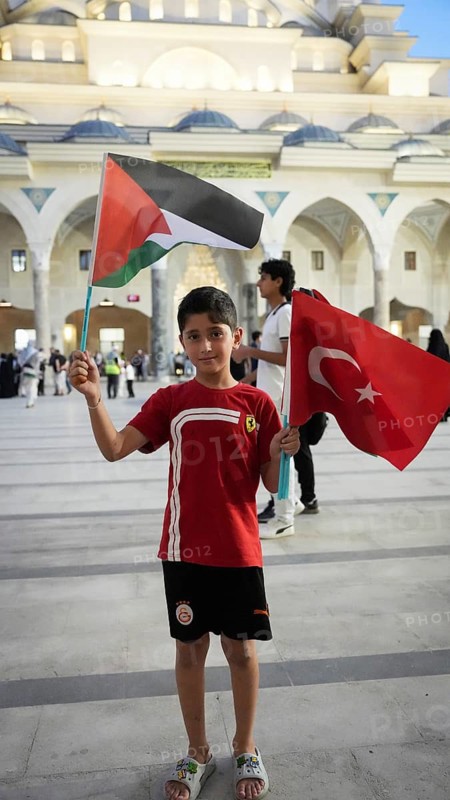 Gaziantep, Turkey - August 06, 2026: Participants of the Palestine Convoy, which set off from Sarajevo, Bosnia and Herzegovina, gather alongside local residents in Gaziantep while waving Palestinian flags to draw global attention to ongoing Israeli attacks on Gaza and the humanitarian crisis in Palestine, Gaziantep, Turkey