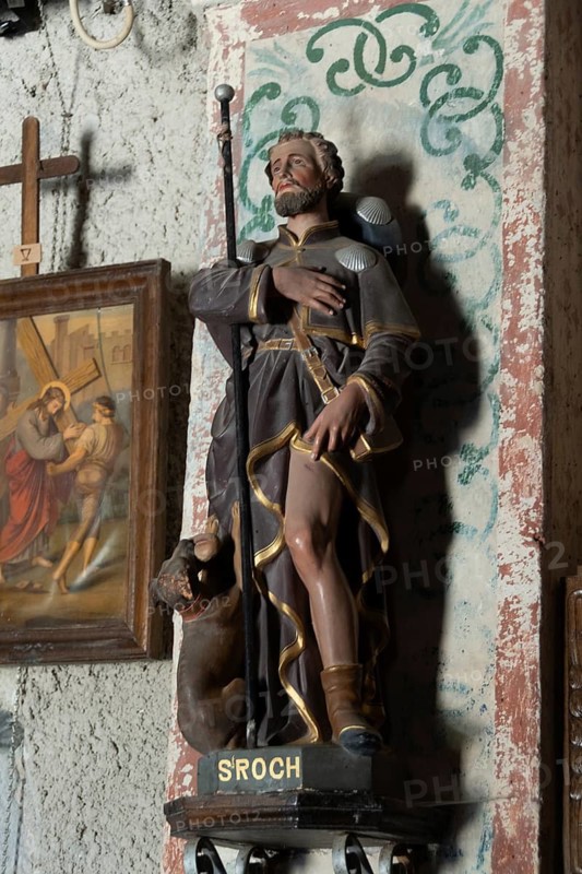 Saint Roch statue inside the church of Montgreleix. Cantal. Auvergne Rhone Alpes. France