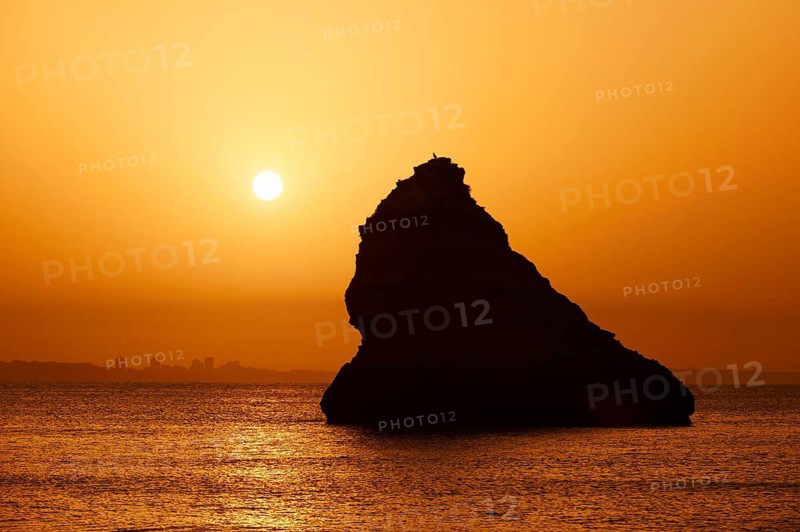 Rocks in the sea at sunrise, Praia Dona Ana, Lagos, Algarve, Portugal