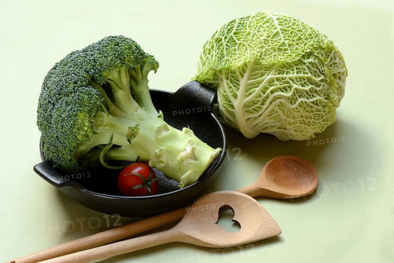 Savoy cabbage and broccoli with cooking spoon