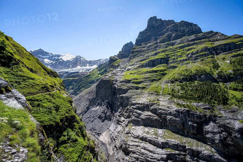 Rocky gorge with waterfall, mountain landscape with Grindelwald-Fiescherfirn glacier, Bernese Alps, Bernese Oberland, Switzerland