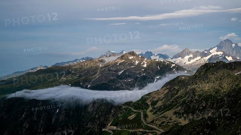 Mountain landscape with clouds of fog, Valais, Switzerland