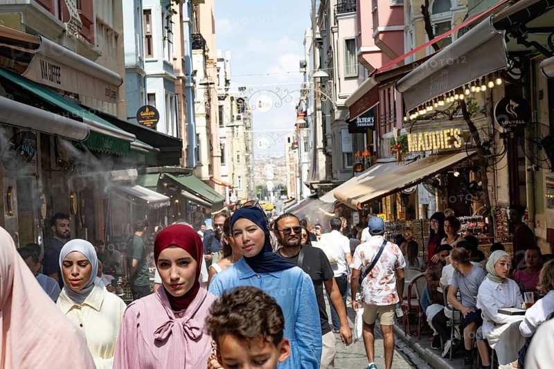 Istanbul, Turkey. August 7th 2026. Busy streets crowded with tourists around the Galata Tower in Istanbul during he summer heat. Turkey