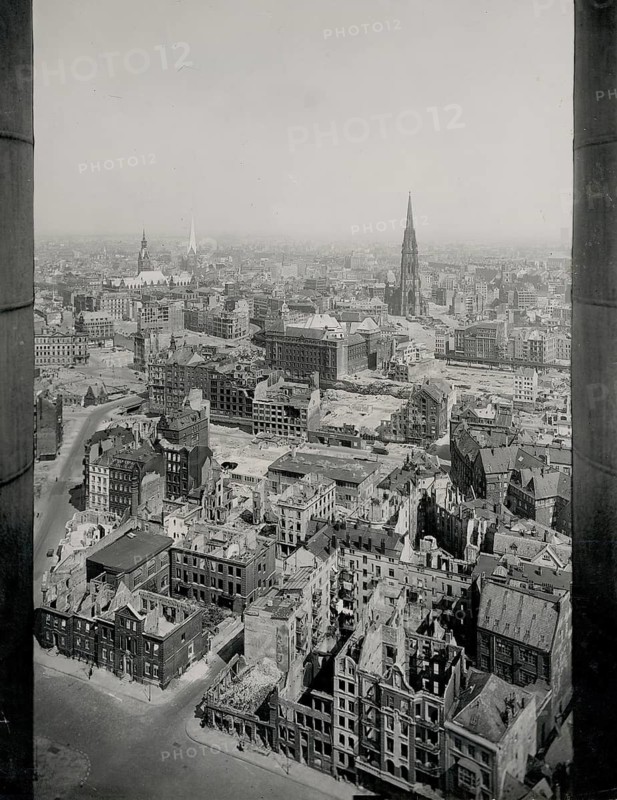 Hamburg, aerial view, of Michaelis church, ruins, end of war, World War II, National Socialism, fascism, a panoramic view of a city with damaged buildings and visible church towers, photo Hans Breuer, 1945