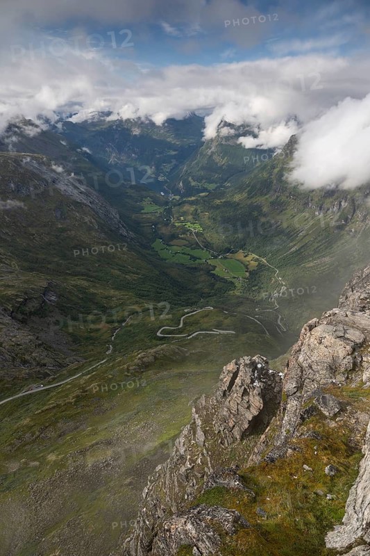 Famous curvy mountain road Fylkesvei 63 or Geirangervegen, which leads from Geiranger to the Djupvasshytta plateau, view of the Geiranger fjord from the 1476 meter high mountain peak and viewpoint Dalsnibba, Stranda, Møre og Romdal, Norway