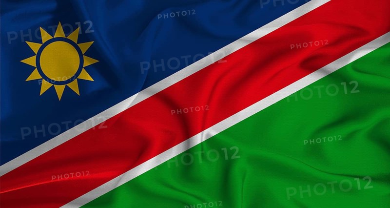 Realistic Namibia flag waving. Close up of flag of Namibia with cloth texture