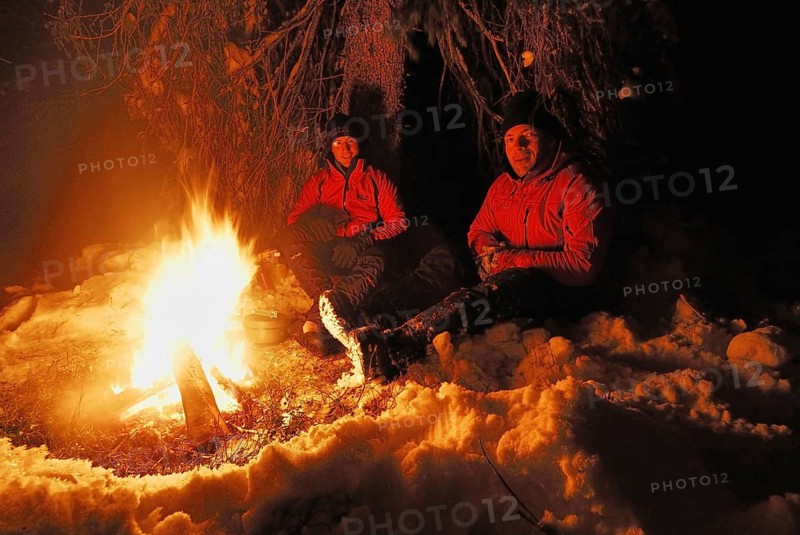 Two men around a campfire, Muddus National Park, Laponia World Heritage Site, Lapland, Norrbotten, Sweden, Scandinavia