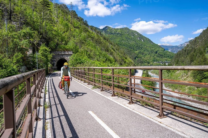 Cyclists with panniers on a cycle path, cycle path along the old Pontebba railway line in the Canal Valley, Alpe-Adria cycle path, bike packing, Friuli-Venezia Giulia, Italy
