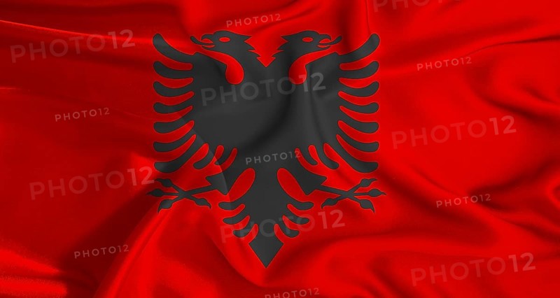 Colorful flag of Albania with a silky fabric texture waving. Realistic Albania flag waving