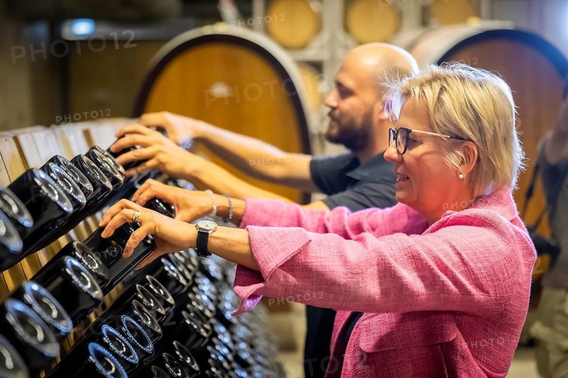 The Saxon Minister of State for Culture and Tourism Barbara Klepsch, together with fountain master Thomas Milster shaking the classic bottled fermentation sparkling wine by hand, Radebeul, Saxony, Germany