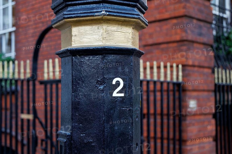 Secret London, Detail of the numbered lamp post door once used by Soviet agents as a Cold War dead letter box on the Audley Square KGB spy lamp post in London, England, United Kingdom