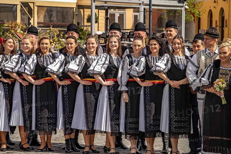 Wedding party in traditional dress on Little Ring Square or Pia?a Mica in the old town of Sibiu or Sibiu, Transylvania, Romania
