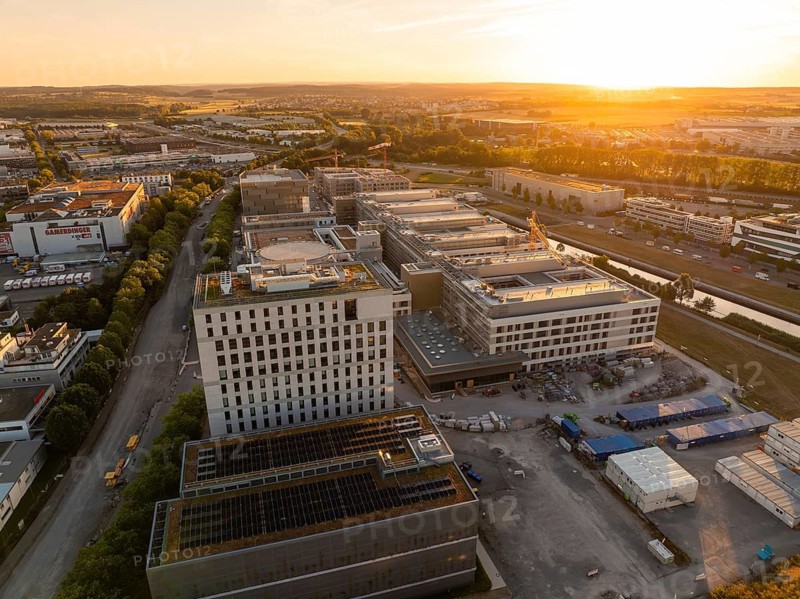Urban architecture in an industrial area at sunset, seen from above, construction site of the new airfield clinic, Böblingen, Germany