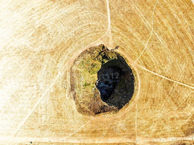 Top Down View of Trevone Round Hole over Trevone Bay from a drone, Trevone, Padstow, Cornwall, England, United Kingdom, Summer 2026