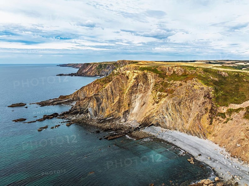 Cliffs and Fields over Welcombe Mouth Beach from a drone, North Devon and Cornwall Coastpath Border, Devon, England, Summer 2026