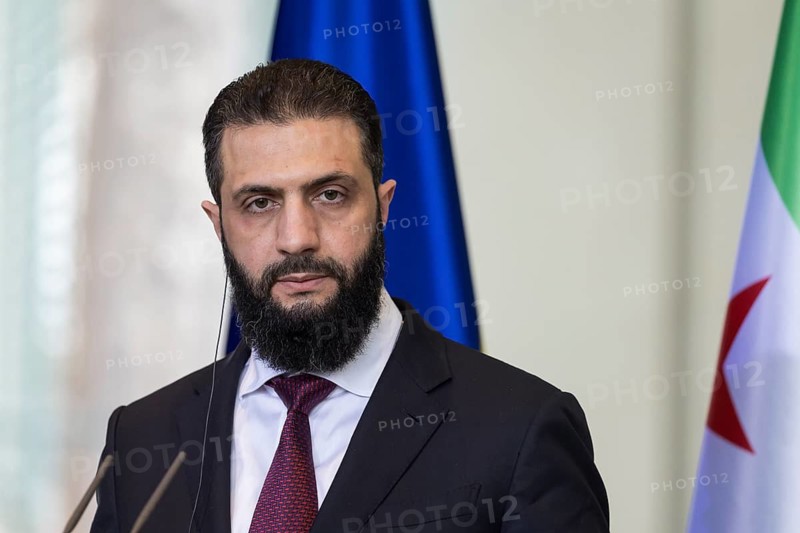 Ahmed al-Sharaa (President of the Syrian Arab Republic) at a joint press conference with Friedrich Merz (Chancellor of the Federal Republic of Germany, CDU) after a one-on-one meeting at the Federal Chancellery, Berlin, 30 March 2026