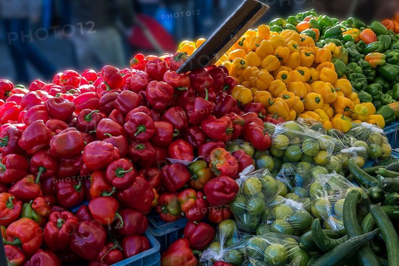 Red and yellow peppers (Capsicum) at a market stall, Enschede, Netherlands