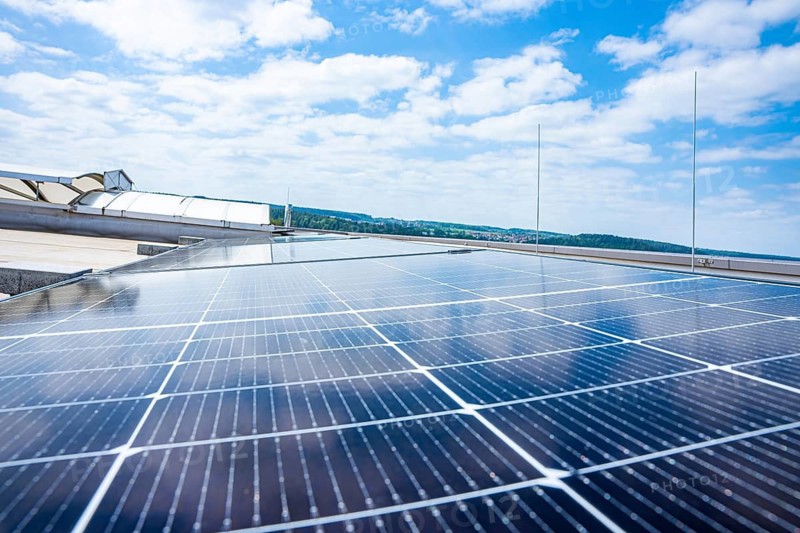 Solar panels stretch under a blue, cloudy sky, PV Assembly, Perrot, Calw, Germany
