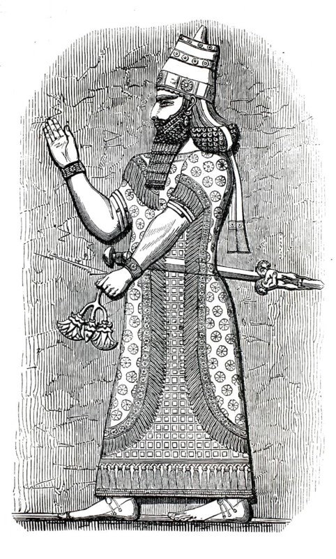 Illustration shows an Assyrian king whose depiction is based on ancient reliefs from Nimrud. The figure is wearing an intricately patterned, long robe with fringes and a tall, cylindrical headdress, authentic, high-resolution reproduction from a 19th century model, exact date of depiction unknown, historical