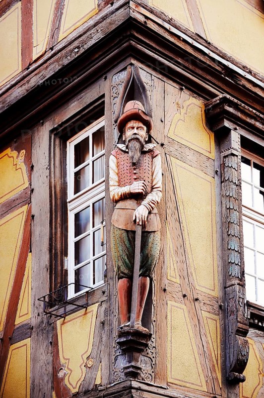 Merchant sculpture at Maison Zum Kragen timbered house, wood carving, Colmar, Haut-Rhin, Alsace, Grand Est, France