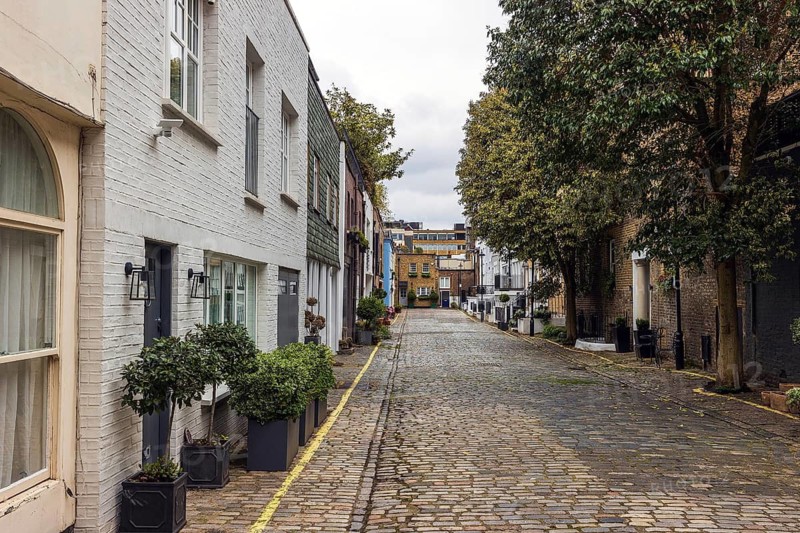 A view along the cobbled length of Montagu Mews West, a former coach house mews in Marylebone, London, England, United Kingdom