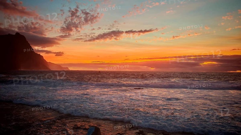 Colourful sunset over the sea with mountains and dramatic sky, Santo Antao, Cabo Verde, Cape Verde Islands
