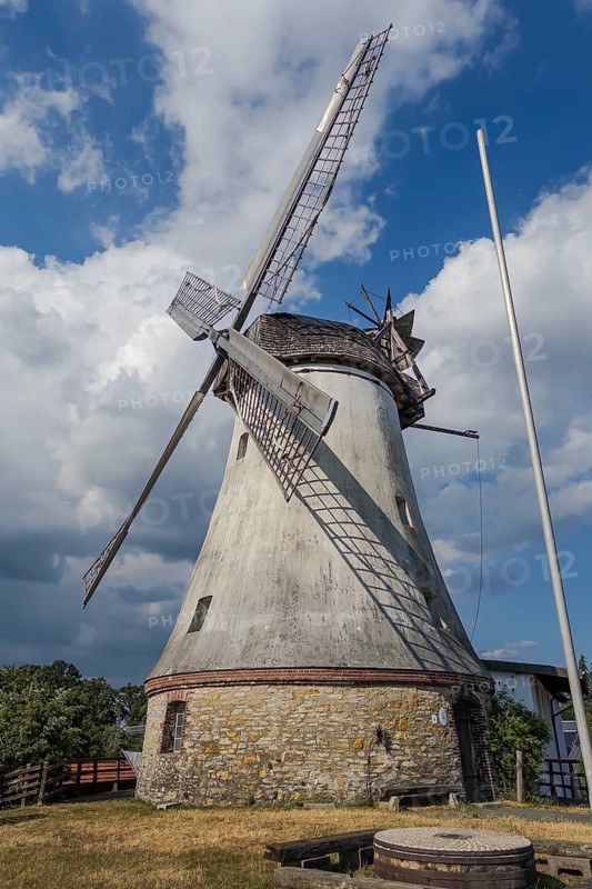 Historic windmill with mill wheel in Lechtingen, Wallenhorst, Lower Saxony, Germany
