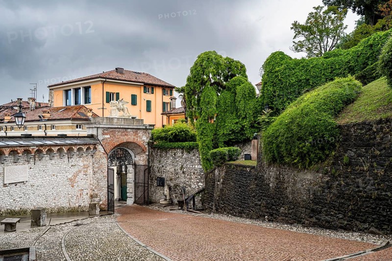 Entrance gate to Castello di Udine Castle, dramatic sky, old town, Udine, Friuli-Venezia Giulia, Italy