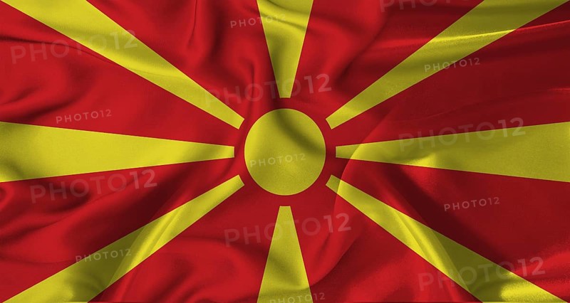 Colorful flag of North Macedonia with a silky fabric texture waving. Realistic North Macedonia flag waving