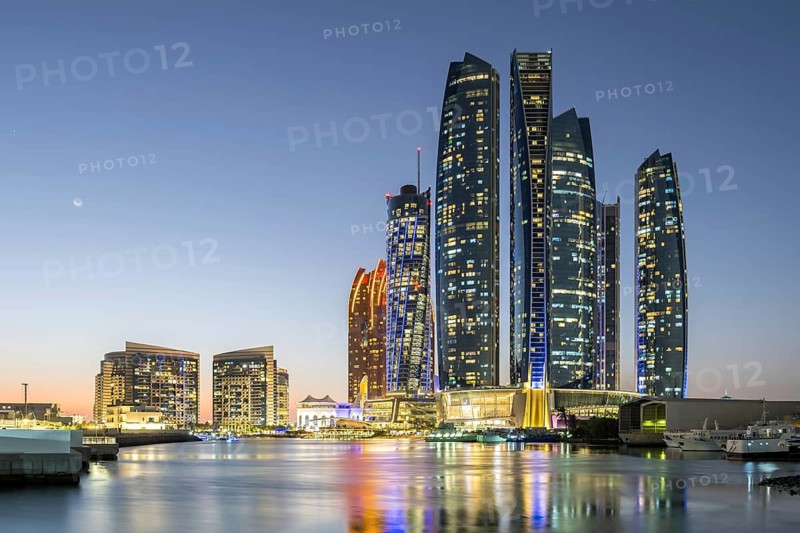 Abu Dhabi Skyline Etihad Towers skyscrapers at night in Abu Dhabi, United Arab Emirates