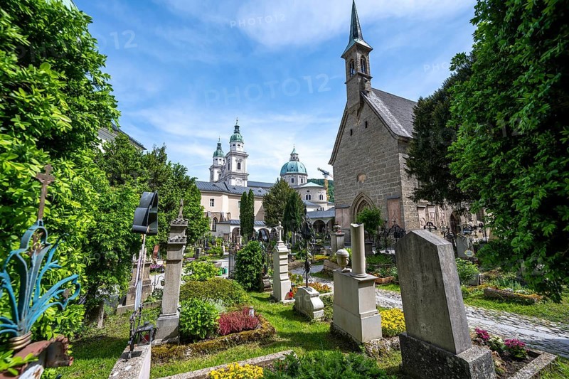 Graves at St. Peter's Cemetery with Margaret's Chapel and Cathedral, Old Town, Salzburg, Austria