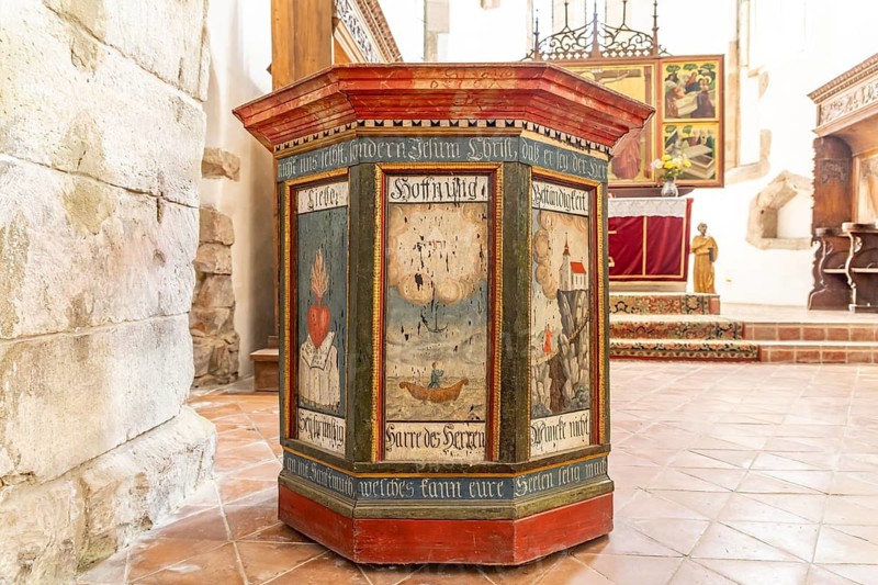 Painted wooden pulpit in the interior of the Tartlau fortified church, part of the UNESCO World Heritage Site in Prejmer or Tartlau, Transylvania, Romania