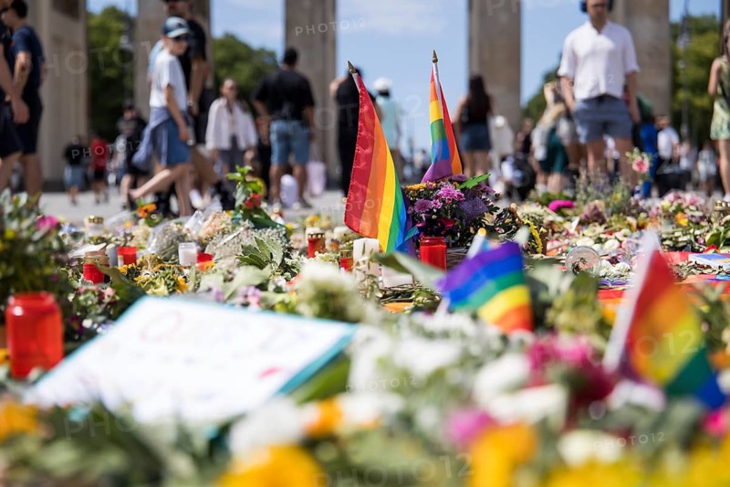 Rainbow flags in an improvised memorial made of flowers and candles on Pariser Platz in front of the Brandenburg Gate in Berlin on 29.07.2026. During the closing Christopher Street Day rally on July 25, 2026, a gunman with a van in Berlin's Tiergarten killed at least one participant and injured several others, some seriously
