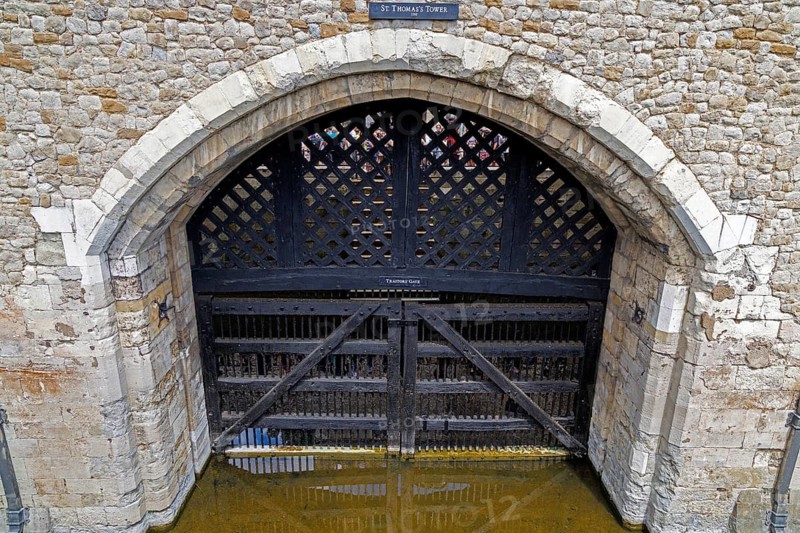 A heavy wooden lattice gate closes the arched entrance of Traitors' Gate beneath St Thomas's Tower, the thirteenth century water gate built for Edward I that later became the infamous river entrance through which state prisoners were brought into the Tower of London, London, England, United Kingdom