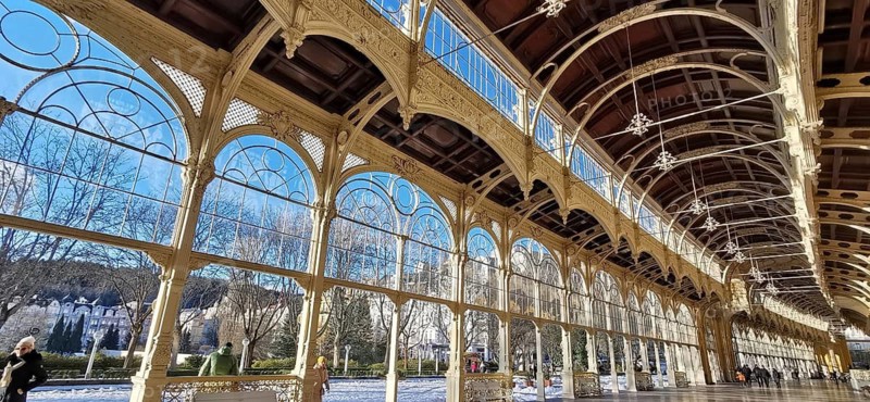 Large stained glass windows in elegant arcades with a view of a sunny day and blue sky, Maxim Gorky Kollonade, Marianske Lazne Main Collonade, Czech Republic