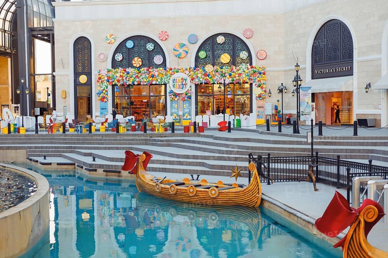 Turkiye, Antalya - 12.03.2025:The Land of Legends shopping street, aquapark and theme park is a popular tourist destination near Belek, Antalya. Fairy-tale boat gondola for tourists on water