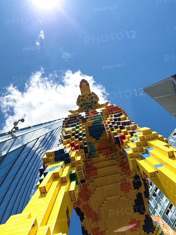 Frog's eye view, The Lego giraffe in front of LEGOLAND at Potsdamer Platz, Berlin, Germany