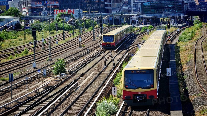 Trains on extensive railway tracks in urban surroundings with modern architecture, Berlin