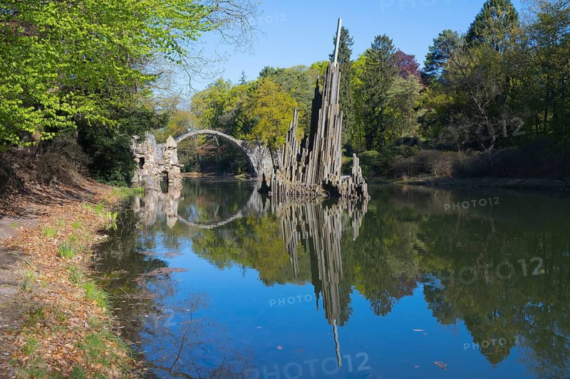 Reflection of a stone landscape structure in the calm water of a forest, Rakotz Bridge, Devil's Bridge, Rakotzsee, arched bridge, reflection, basalt organ, Kromlau, Görlitz district, Saxony, Germany
