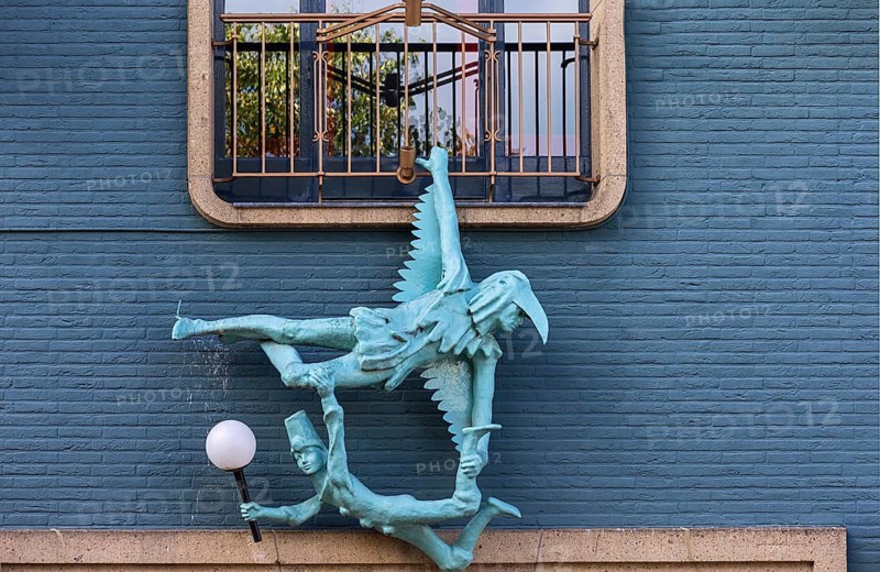 Figures on the façade of the Dille & Kamille department store, formerly a theatre, Enschede, the Netherlands