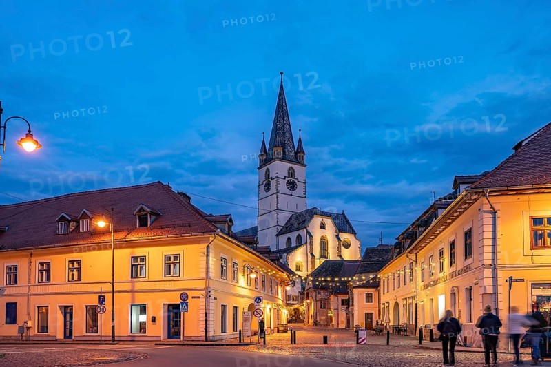 Old town and the Lutheran parish church in Sibiu or Sibiu at dusk, Transylvania, Romania
